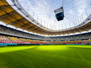 Massive Soccer Stadium Filled. Wide view of empty stadium. Green grass on a sport Arena. Empty Football Soccer Stadium Tribune. National arena with empty seats. Sport event on National Arena. 