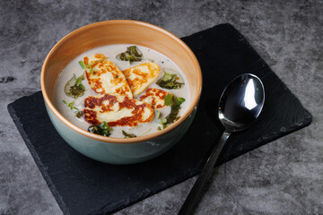 Creamy Cheese Soup, Garnished with Herbs and Melted Cheese