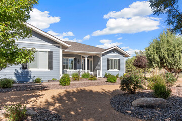 A beautiful house with many windows and trees in front of it