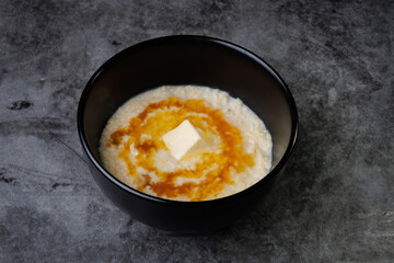 Creamy Porridge Bowl With Butter And Honey For Cozy, Warm Breakfast Moments At Home Everyday