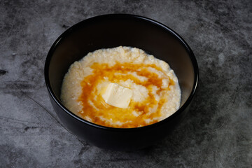 Creamy Porridge Bowl With Butter And Honey For Cozy, Warm Breakfast Moments At Home Everyday