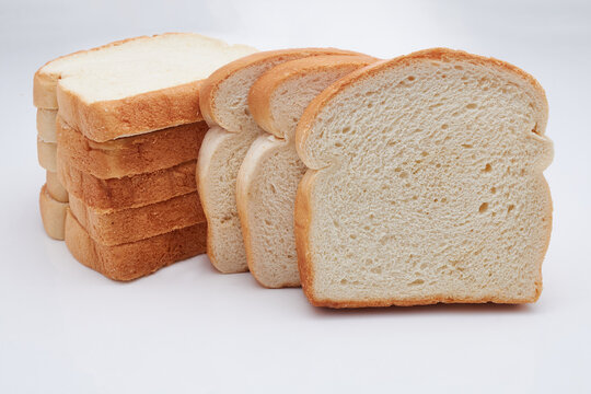 Eight (8) slices of freshly baked Jamaican hard dough bread isolated on a white background