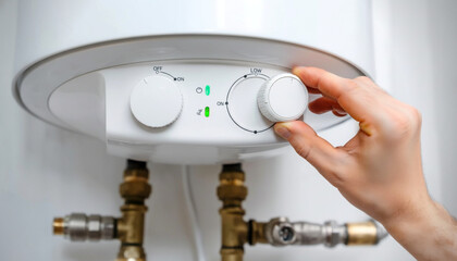 Close-up of a hand adjusting the thermostat on a domestic water heater, indicating temperature control for home comfort and energy efficiency