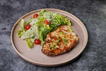 Grilled Chicken and Fresh Romaine Salad on Beige Plate with Cherry Tomatoes - Healthy Dinner Idea