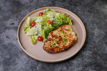 Grilled Chicken and Fresh Romaine Salad on Beige Plate with Cherry Tomatoes - Healthy Dinner Idea