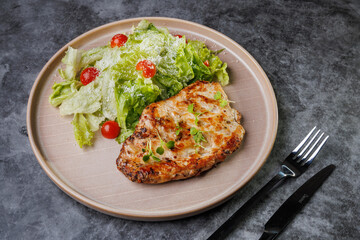 Grilled Chicken and Fresh Romaine Salad on Beige Plate with Cherry Tomatoes - Healthy Dinner Idea