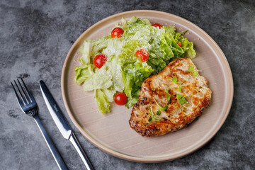 Grilled Chicken and Fresh Romaine Salad on Beige Plate with Cherry Tomatoes - Healthy Dinner Idea