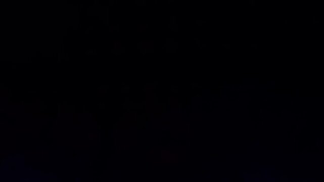 Defocused bokeh background with colorful LED lights at the night club