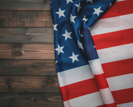 Proudly display the American flag on rustic wood for July 4th celebrations and patriotic events offering freedom, unity, and national pride