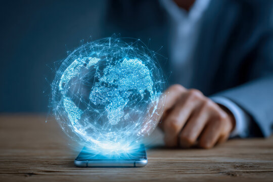 Futuristic digital globe projected from smartphone illustrating global connectivity and technological innovation in a professional setting
