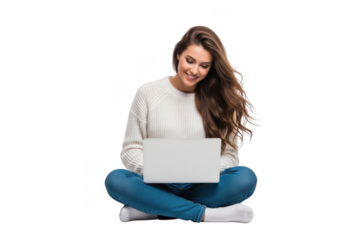 Young woman sitting cross legged on the floor using a laptop with a smile on her face and long brown hair