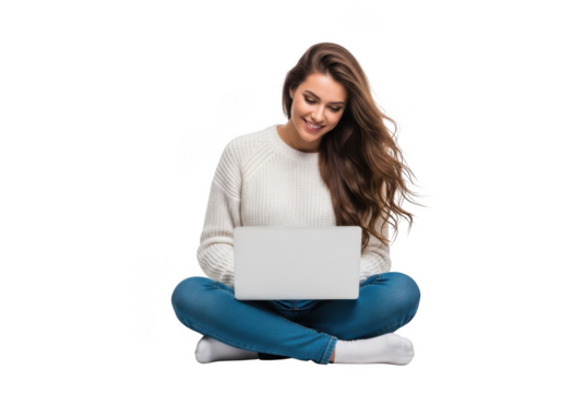 Young woman sitting cross legged on the floor using a laptop with a smile on her face and long brown hair