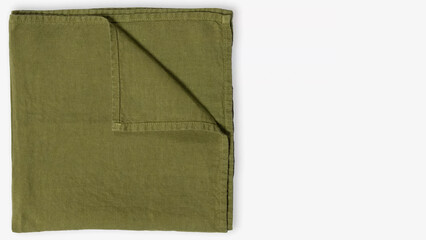Soft green linen napkin neatly folded on a simple background for elegant dining decoration.