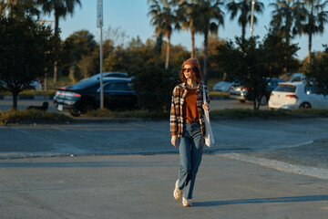 Woman walking casual in a golden, candid urban scene at golden hour glow, authenticity and mindful living captured with emotional storytelling, relaxed smile, tote and vintage jacket.
