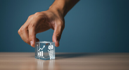 Grow Your Business Strategically with Modern Data Analytics and Shopping Success shown on a Clear Cube Being Held by a Hand, Showing Charts and Graphs