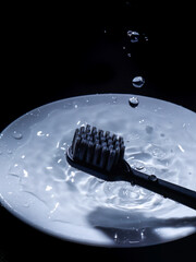 The black toothbrush with water