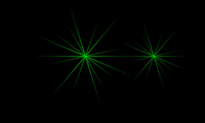 Sharp green light rays creating starburst effect on darkness