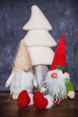 Two Christmas gnomes in front of a papier-m&acirc;ch&eacute; silver fir