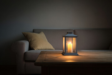beautifully crafted lantern with flickering candle sits gracefully on simple wooden table creating warm and