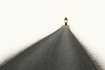A lonely lantern at the end of an empty road. Space for text.