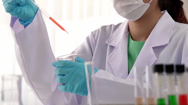 Laboratory researcher develop new medicine or cure use colorful chemical liquid in lab tube. Technological advance of healthcare with scientific or chemistry expertise and laboratory equipment. Rigid.