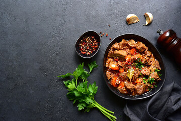 Goulash (meat stew with tomatoes and paprika) - traditional dish of hungarian cuisine .Top view with copy space.
