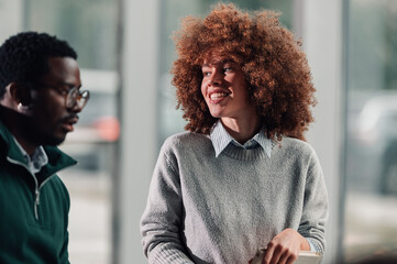 Diverse colleagues having a pleasant discussion in office