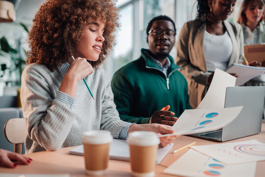 Diverse business team collaborating on project data analytics
