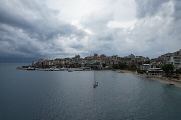 Obraz premium Aerial view of Sarande, a historic Albanian harbor town on the Ionian coast, featuring waterfront landmarks, boats, and Mediterranean architecture.Saranda city