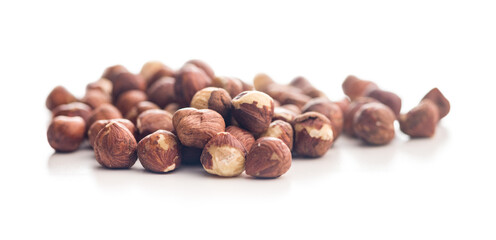 Peeled hazelnut kernels isolated on white background.