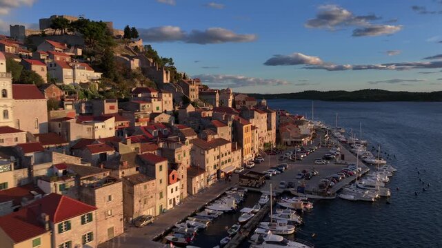 Amazing Flyby at Sunset over Sibenik, Croatia. St. James Cathedral, a UNESCO World Heritage, terracotta rooftops.