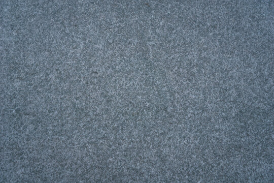 dark speckled gray surface background texture with fine granular pattern concept of acoustic paneling, textile design, stone products - Powered by Adobe