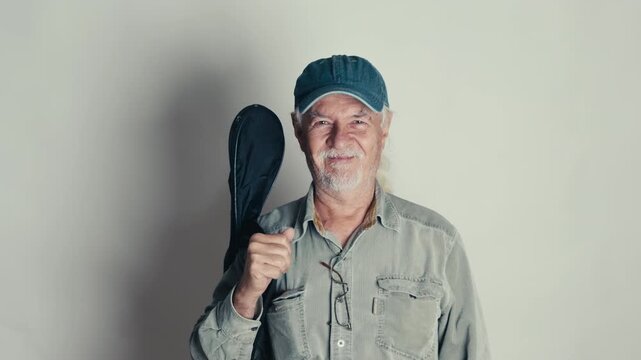 Old Man Waves Goodbye with His Guitar and Disappears