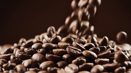 Close-up of coffee beans in motion, rich brown tones evoking warmth and comfort, perfect for International Coffee Day or cozy moments
