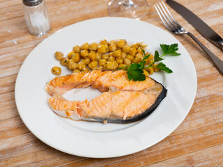 Healthy eating. Slightly fried salmon served with chickpeas