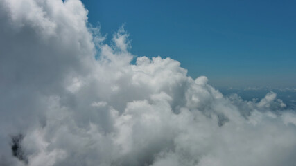 Flying through white fluffy clouds
