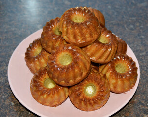 delicious, ready-made muffins on a plate are ready to eat. A fragrant dessert after baking in the oven. A tasty treat for children and adults. Sweetness for tea or coffee.