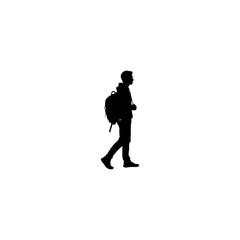 Stylish silhouette of a young man with backpack exploring the world on his inspiring travel adventure