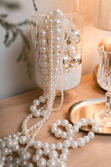 Pearl necklace and Christmas decor on the table