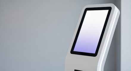 modern digital kiosk with touchscreen display against gray background in public space