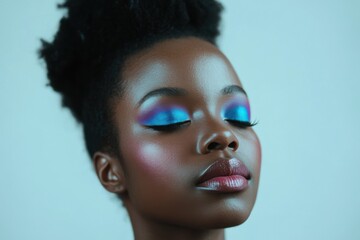 A captivating portrait highlighting a model with vibrant, artistic makeup, showcasing bold colors and delicate features that express confidence and individuality in beauty.