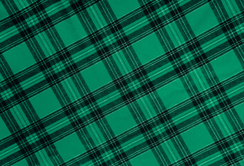 texture of  green black white diagonal checkered fabric pattern background. traditional tablecloth...