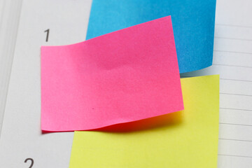 Colorful sticky notes on notebook page
