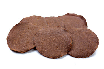 Fermented soybean discs, known as “Thua Nao,” a traditional Thai seasoning used to enhance flavor in Northern cuisine.