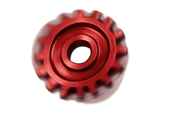 Red cogwheel spinning fast, symbolizing industrial power, continuous development, technology, and interconnected processes. Transparent background