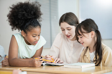 Portrait of smile teacher help elementary school children with digital tablets desks, show technology integration modern learning in classroom. Back to school, education.