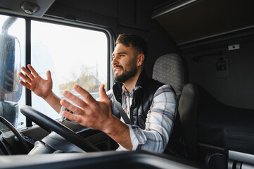 Obraz premium Truck driver expressing feelings while driving a vehicle