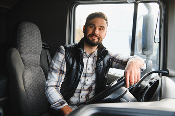 Obraz premium Happy man driving truck working in transportation