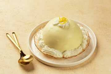 Lemon Delight, or Delizia al Limone, dessert from Amalfi Coast, Italy. These mini sponge cake filled with pastry cream and coated with lemon custard  cream.