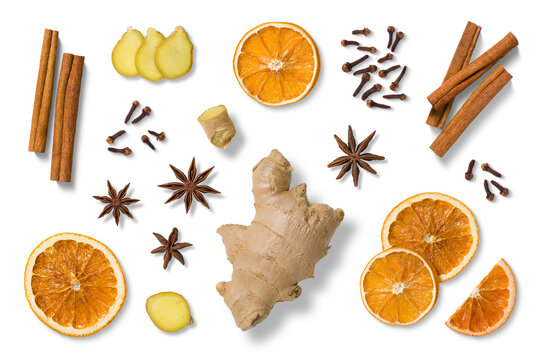 Collection of natural winter and Christmas elements, including dried orange slices, cinnamon sticks, star anise, fresh ginger, cloves and ginger slices isolated on a transparent background, PNG. 